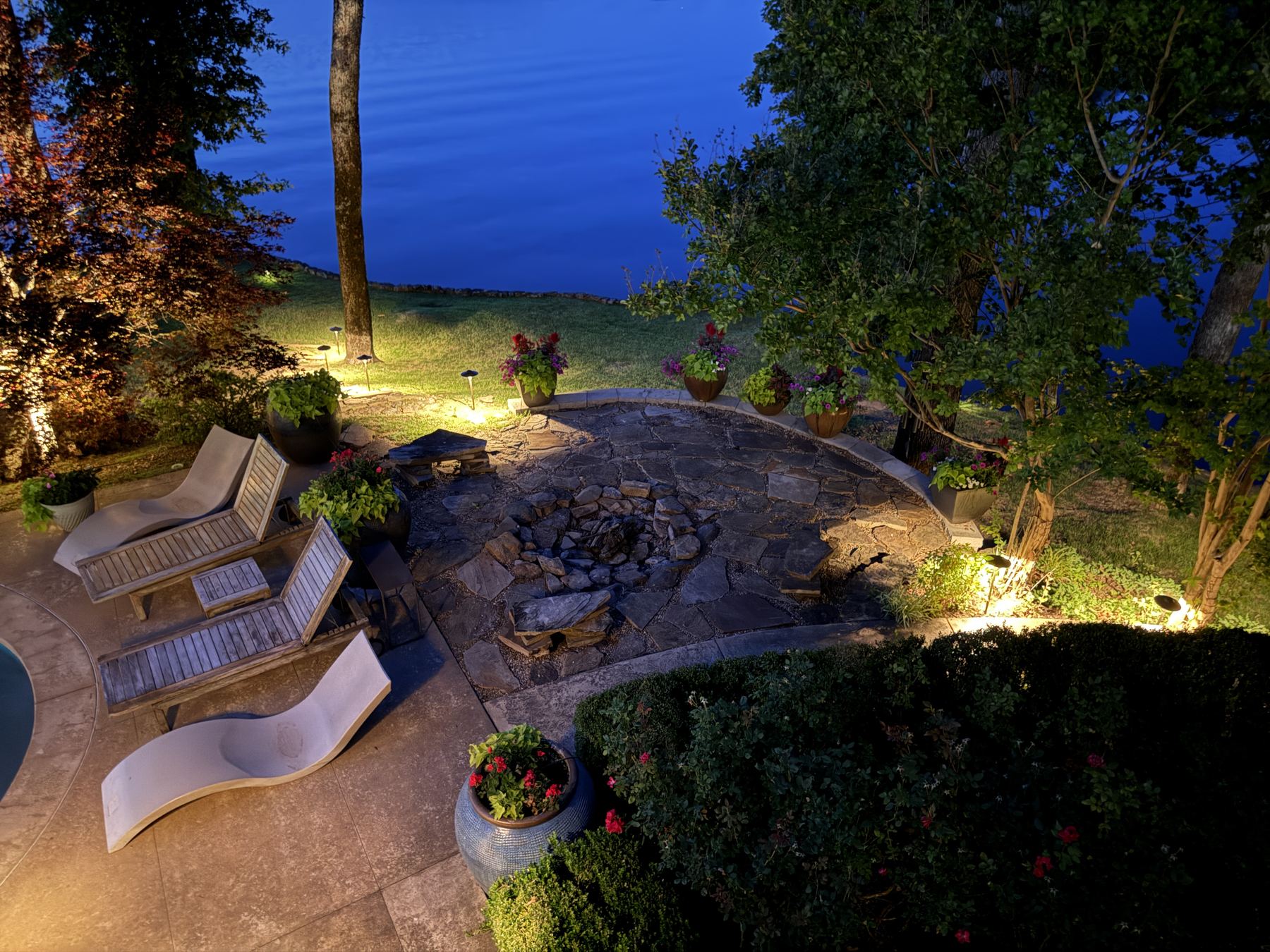 Fire pit patio and lakeside landscape lighting