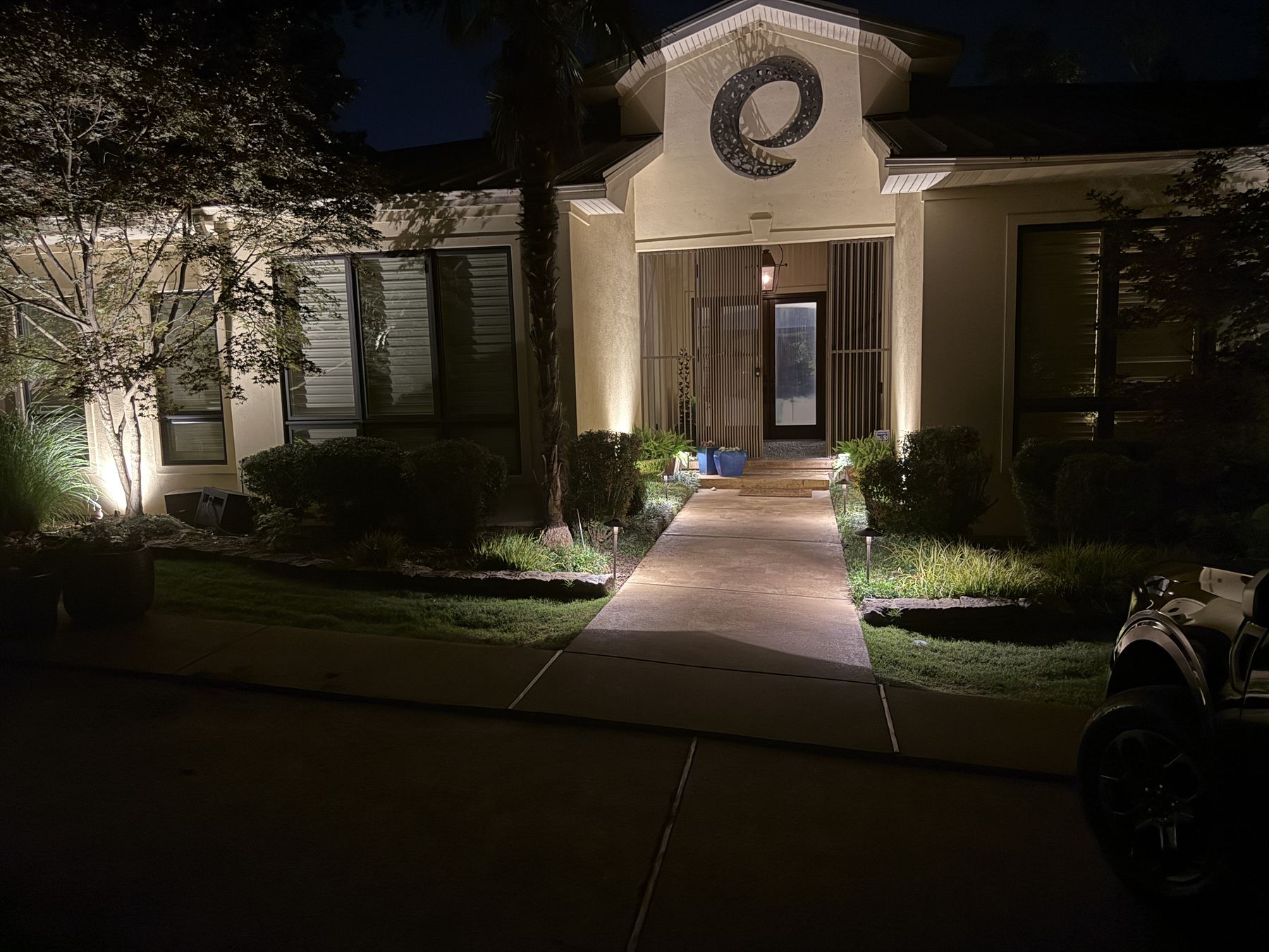 Residential front facade with landscape lighting